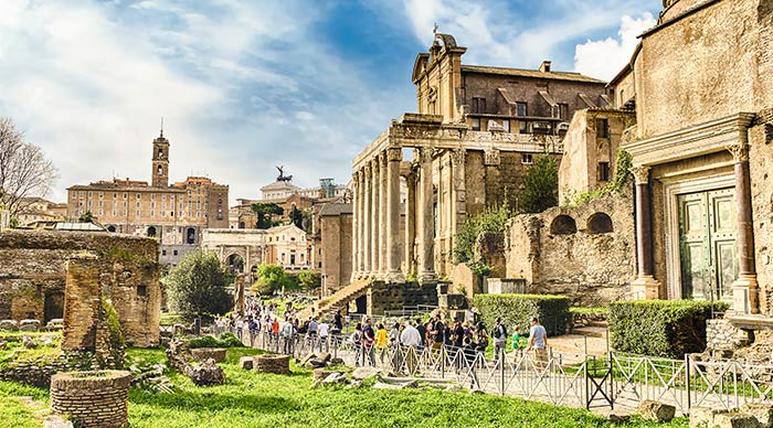 Tourists walking among the ruins of Roman Forum in Rome 