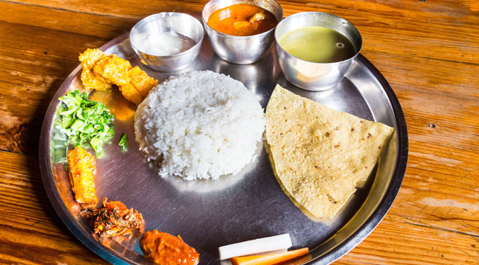 Delicious Nepali Thali meal set with chicken curry