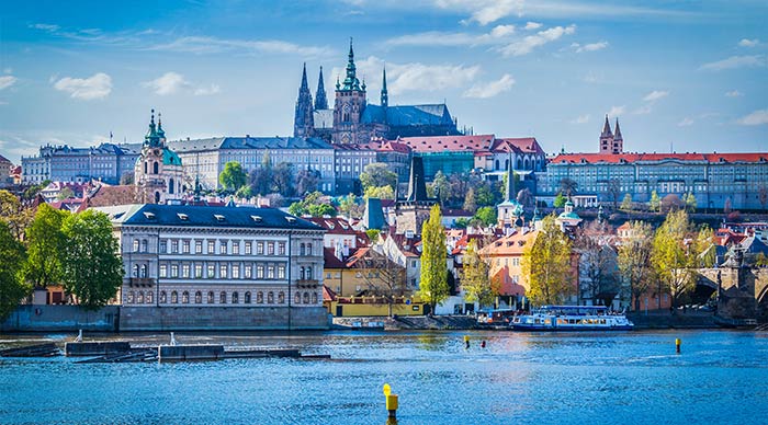 A view of Gradchany (Prague Castle) and St. Vitus Cathedral over the Vltava river in Prague Czech Republic